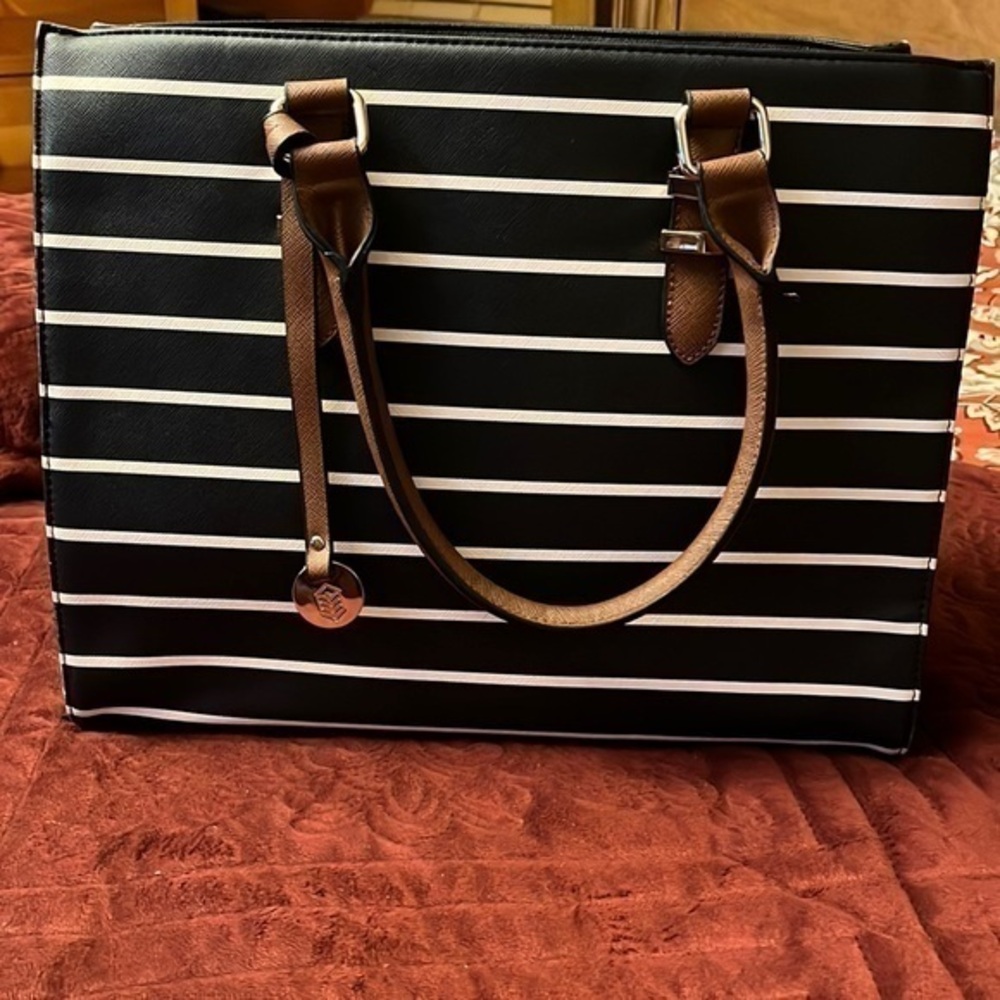 Call it spring bag color black and white and brown nice handbag good condition